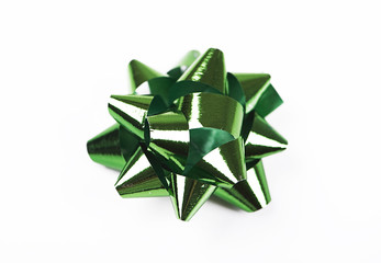 Bow with star shape of green color decoration paper on white background