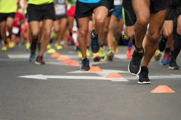 Marathon running race, people feet on city road