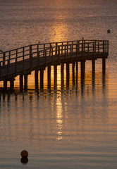 Fototapeta premium Beautiful sunrise in the summer by the quiet sea