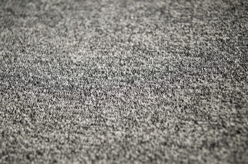 Texture of grey melange fabric with white and black fibers, neutral grey textile background