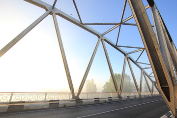 bridge in fog at sunrise