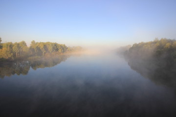 Fototapeta na wymiar river in the fog in the early morning
