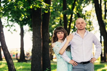 Beautiful young couple on the park background