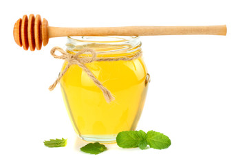 honey with honey dipper isolated on white background
