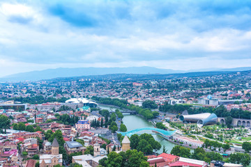 Fototapeta na wymiar The Bridge of Peace over the Kura River in Tbilisi