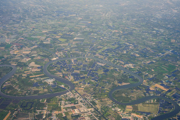 Bird eye view of residential landed early in Thailand. Aerial view from the window of an airplane