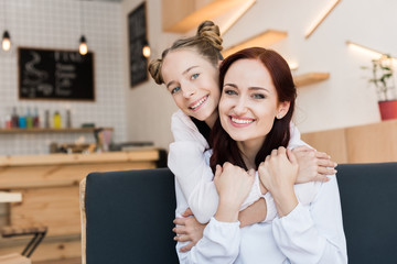 mother and daughter in cafe