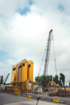 Construction site. Small cement factory, Truck crane and other engineering motor vehicle