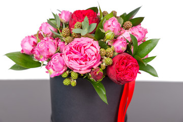 Incredible bouquet of pink roses and red ribbon in a concept of love