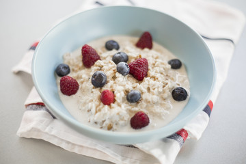 Healthy breakfast - oatmeal with blueberries and raspberries