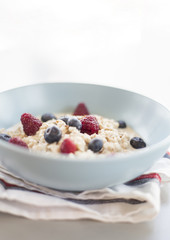 Healthy breakfast - oatmeal with blueberries and raspberries