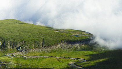 Fototapeta premium curved road in mountain landscape, Transalpina. Romania