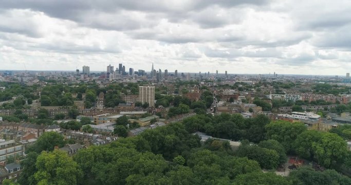 Aerial approaching view of the skyline of central London from a park
