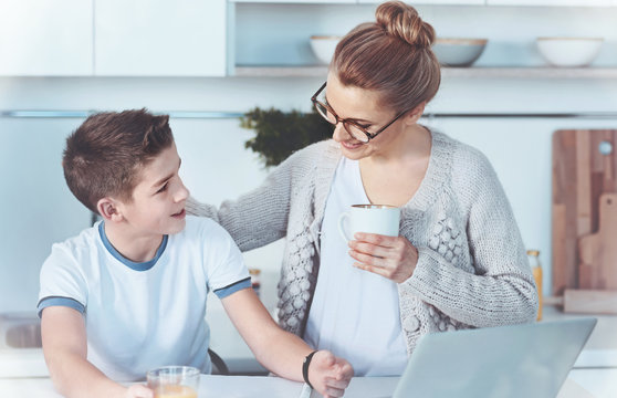 Smart Boy Asking Mom For Help With Home Assignment