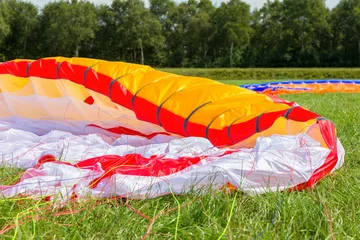 Parachute lying in green grass