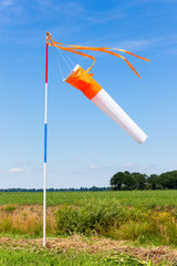 Wind meter in rural area with blue sky