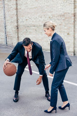 business colleagues playing basketball