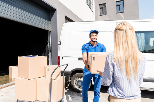 Courier Giving Package To Woman