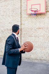 businessman with basketball ball