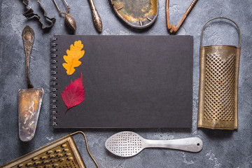 Black notebook and vintage kitchen supplies