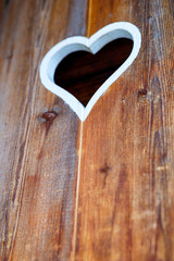 Wooden fence with heart. Part of a window in Tirol, Austria
