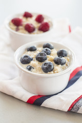 Healthy breakfast - oatmeal with blueberries and raspberries