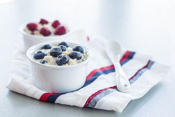 Healthy breakfast - oatmeal with blueberries and raspberries