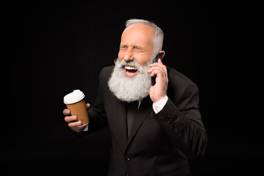 Laughing businessman talking on phone