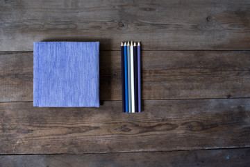 Diary notebook and pencil on the wooden table