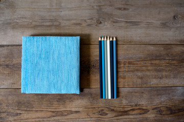 Diary notebook and pencil on the wooden table