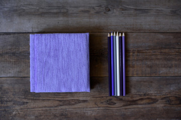 Diary notebook and pencil on the wooden table