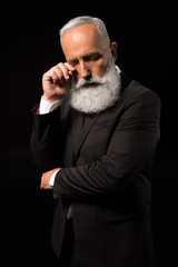 businessman wiping tears away