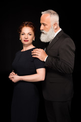 man touching woman on shoulder