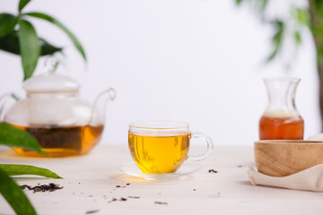 Cups of tea on wooden table background