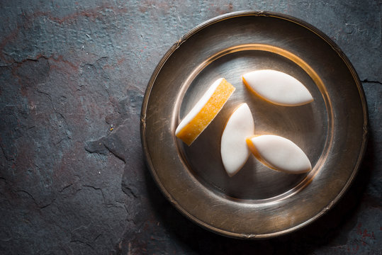 Calissons d'Aix-en-Provence on a plate on background. Traditional French Provence sweets.