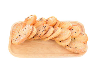 Black heart sesame biscuit in wooden plate isolated on white background