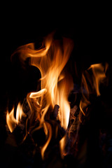 Fototapeta premium Shaped flame of fire isolated on a black background.