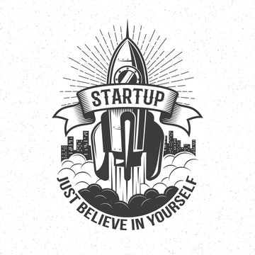 Startup retro logo - rocket launch in the sky with word on ribbon and believe in yourself motto.  Vintage emblem with spaceship.