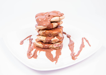 Pancakes with apples covered with chocolate