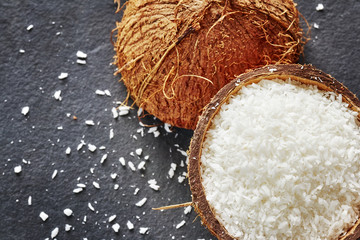 Coconut shreds on a dark slate background.