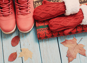 winter clothes and shoes on a wooden background