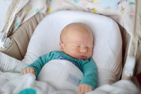 newborn sleeping in crib