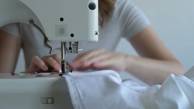 Close up of a woman sewing
