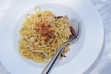 Spaghetti carbonara with ham in white plate - Italian food style