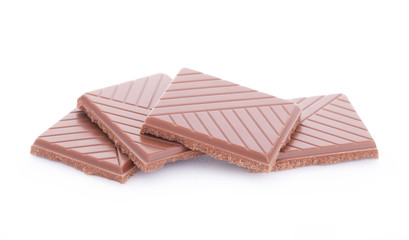 Slices of milk chocolate isolated on white background