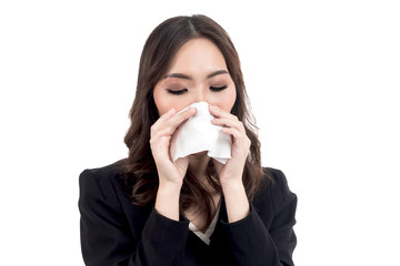 Sick woman blowing her nose with tissues isolated on white background