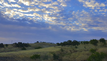 Fototapeta na wymiar landscape of a hill on a background of clouds