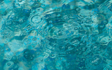 Close up of bubbles in blue water.