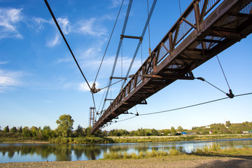 the river Kondoma,suspension bridge,Russia