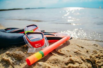 Mask with snorkel and flippers on the beach © phpetrunina14